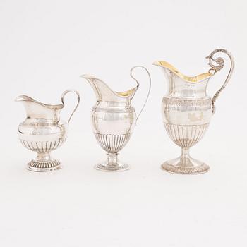 A set of three Swedish silver Empire jugs, first part of the 19th Century.