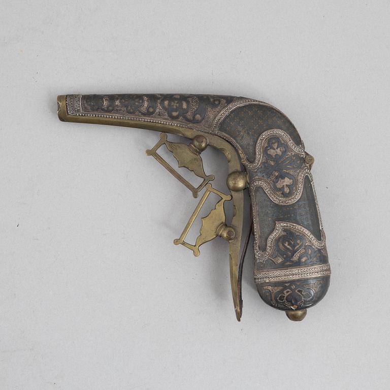 A Caucasian priming flask.