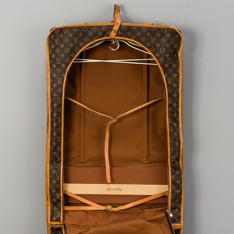 A Louis Vuitton vintage Monogram Canvas Homme Garment Bag.