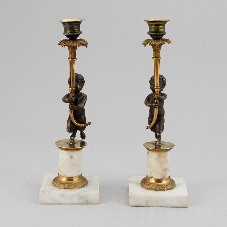A pair of gustavian style candles sticks, circa 1900.