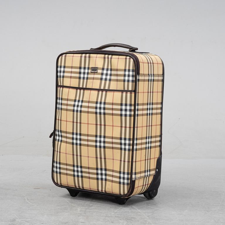 Burberry, a Nova Check canvas suitcase.