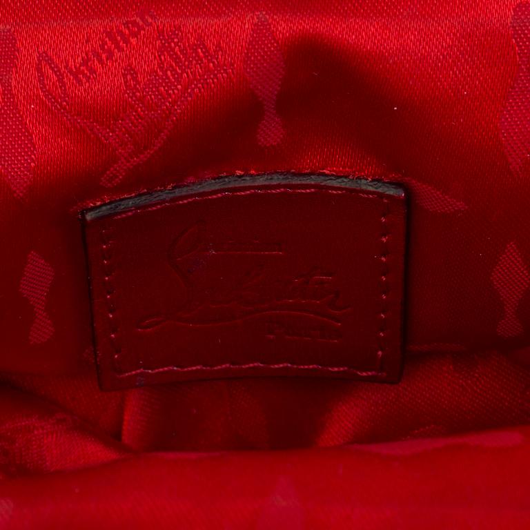 A black silk handbag by Christian Louboutin.