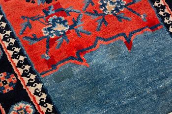 Matto, a saddle cover/a rug, semi-antique/old China, ca 129 x 63 cm.