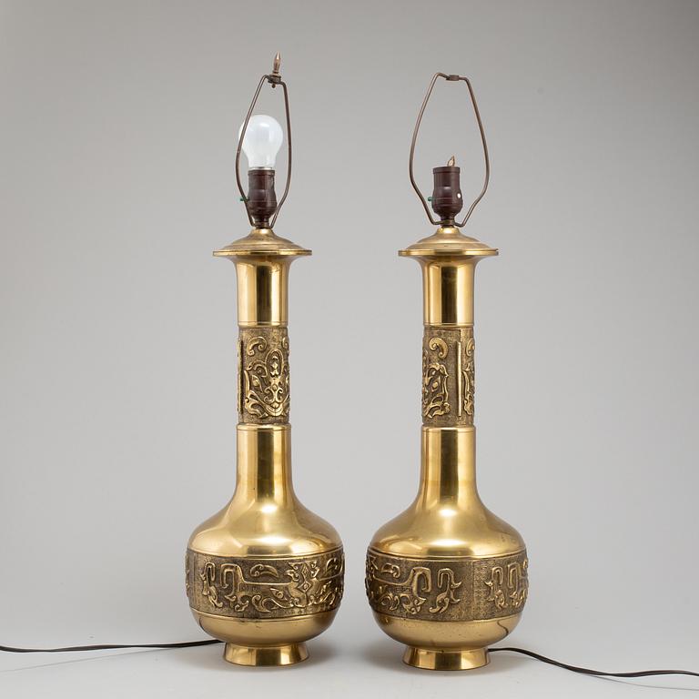 A pair of Chinese brass table lamps, 20th century.