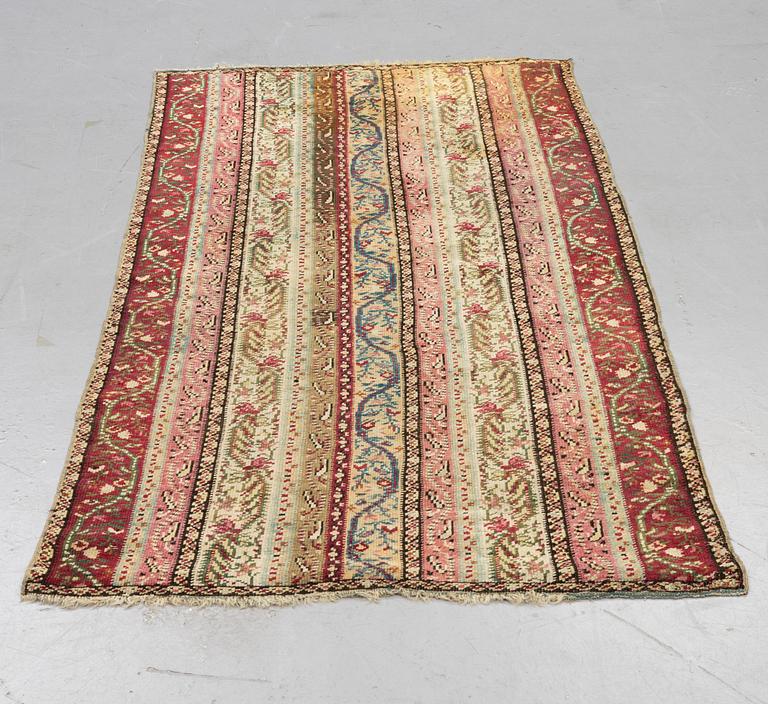 A rug, antique Gördes (Ghiordes), ca 206 x 113 cm.