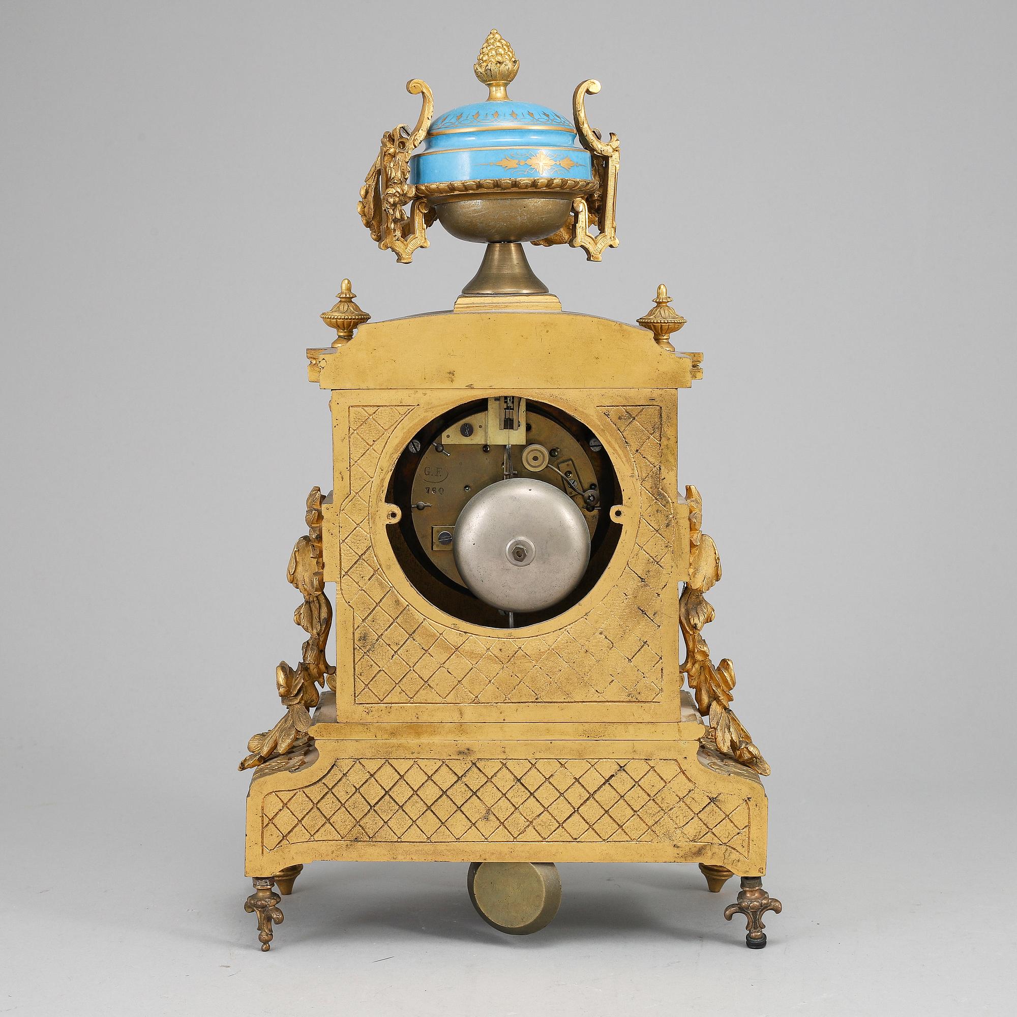 A late 19th Century bronze and porelain mantel clock.