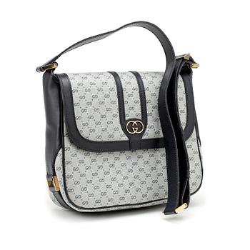 679. GUCCI, a coated blue monogram canvas shoulder bag.