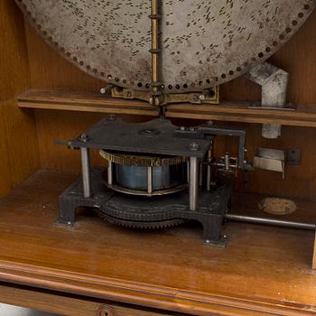 Polyphone with clock in walnut case, late 19th Century.