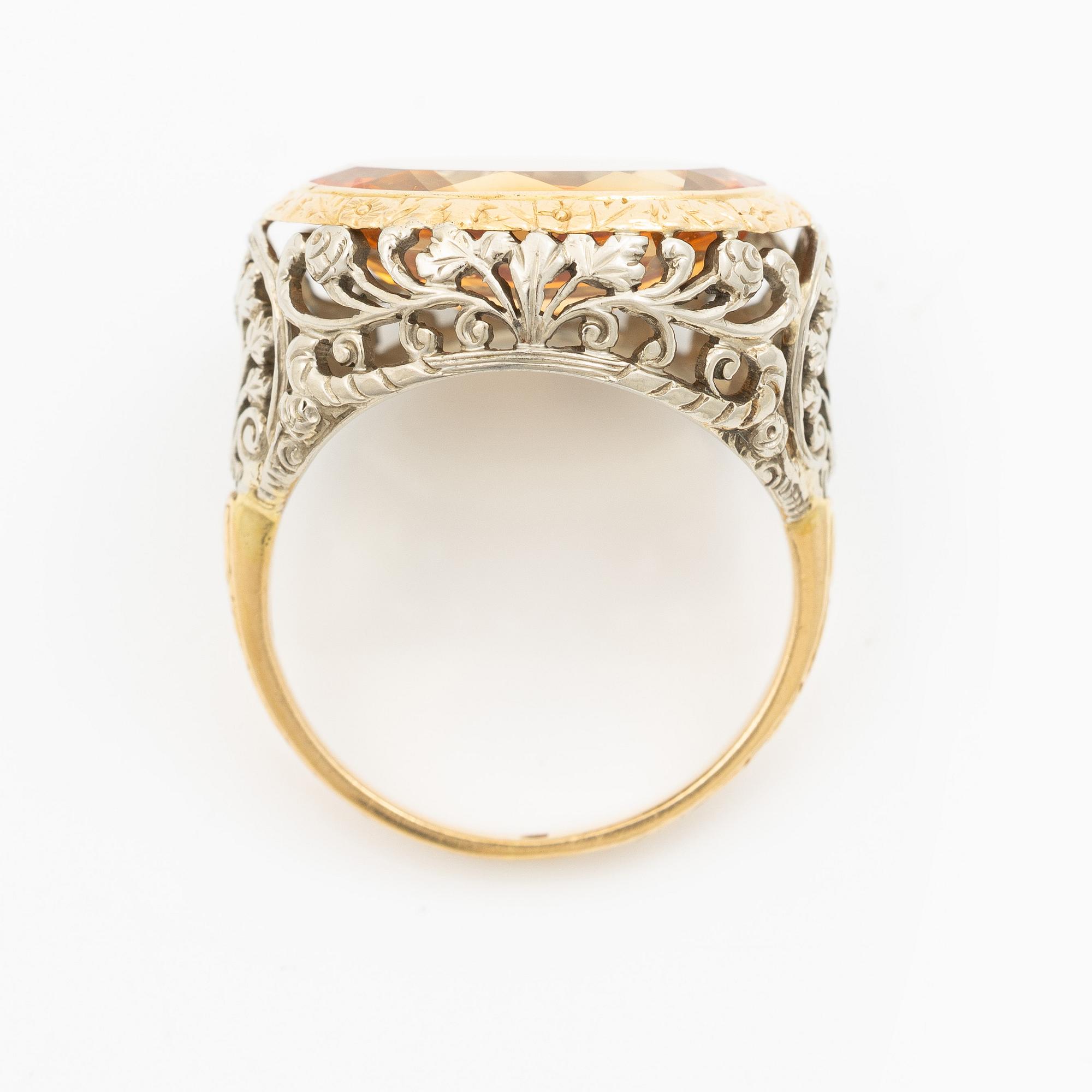 Gold ring with synthetic yellow sapphire.