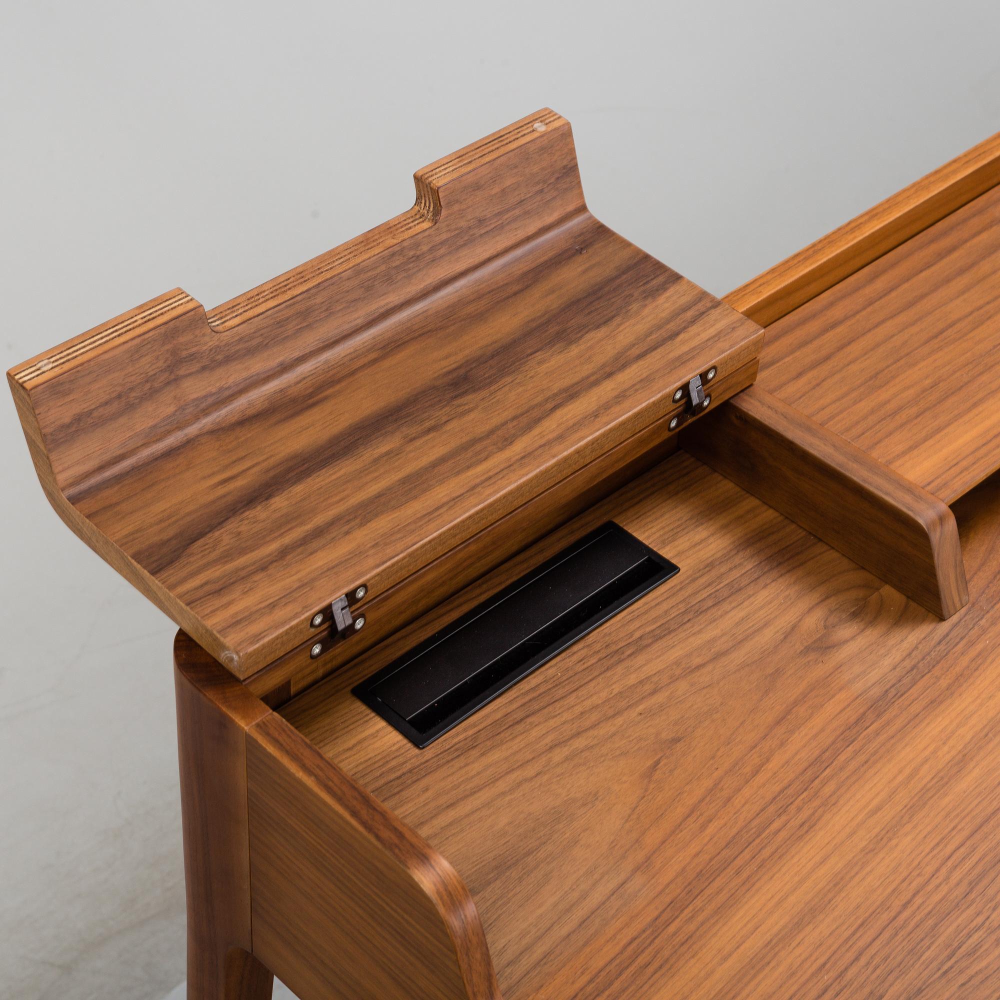 A 21st Century walnut 'Saffo' writing desk by Carlo Ballabio, from Porada.