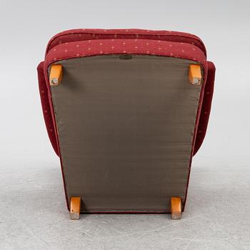 Carl Malmsten, a 'Häggbom' armchair with a 'Jättepaddan' ottoman, AB OH Sjögren, Tranås.