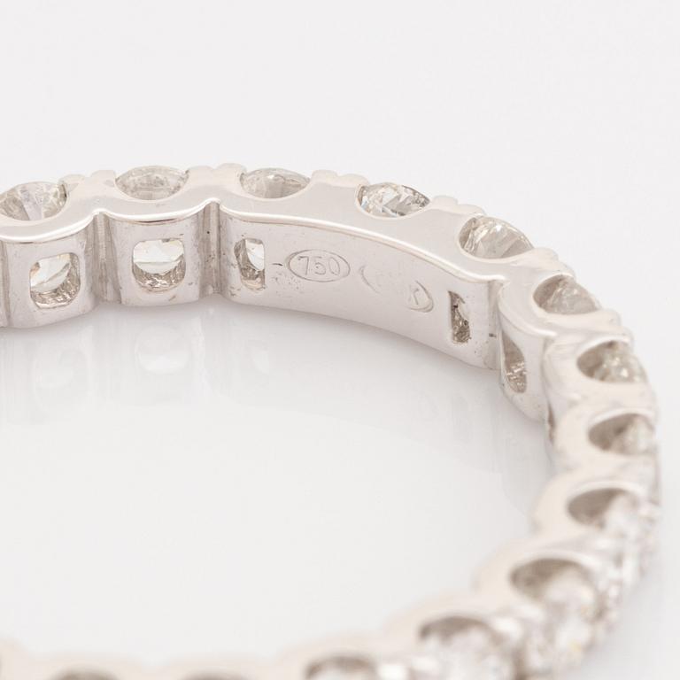 Brilliant-cut diamond eternity ring.