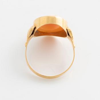 A demi-parure in 18K gold with sea shell cameos.