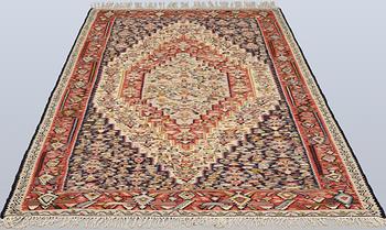 A semi-antique Kilim rug, Senneh, c. 230 x 147 cm.