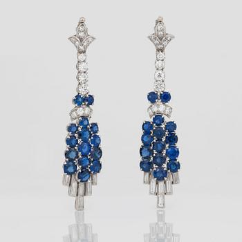 A diamond and sapphire set, probably Garrard & co. The set can be worn as a necklace, earrings, double clip or brooch.