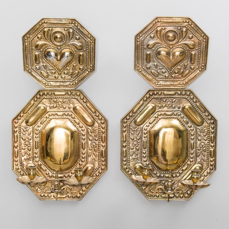 A pair of bronze wall scones from the early 20th Century.