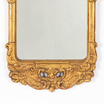 A Rococo mirror, 18th Century.