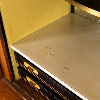 A Danish 1950s-60s cabinet with bar compartment.