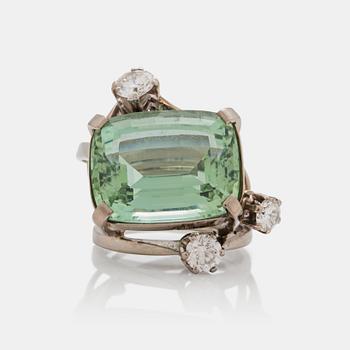 A circa 17.00 ct green beryl and brilliant cut diamond ring. Total carat weight of diamonds circa 1.29 cts.