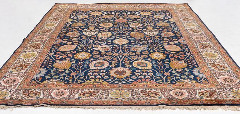 A semi-antique Tabriz carpet, c. 395 x 295 cm.