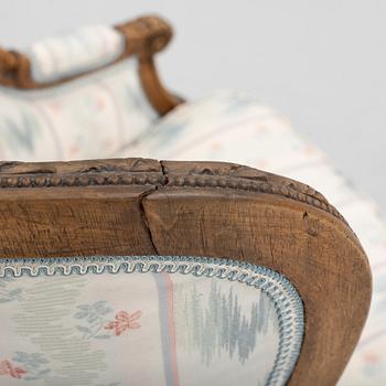 A Louis XVI-style bergere, late 19th century.
