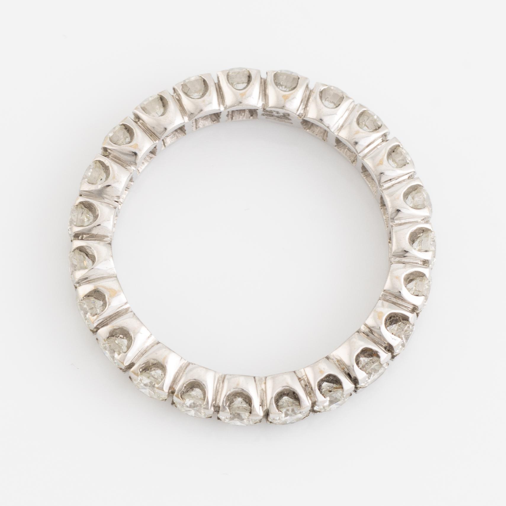 Brilliant cut diamond eternity ring.