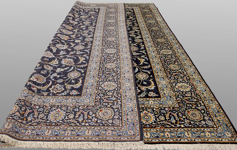 A Keshan carpet, signed, approx. 430 x 320 cm.