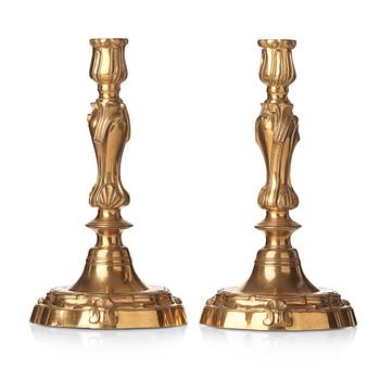 A pair of French Louis XV 18th century gilt bronze candlesticks.