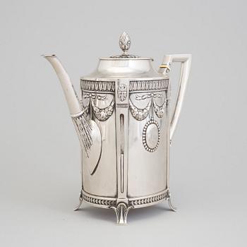 A set of three silver objects (coffeepot, creamer and sugarbowl, CG Hallberg and GAB, Stockholm 1907. Weight ca 1226 gr.