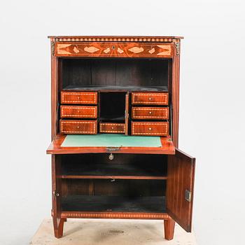 A Louis XV mahogany secretaire around 1800.