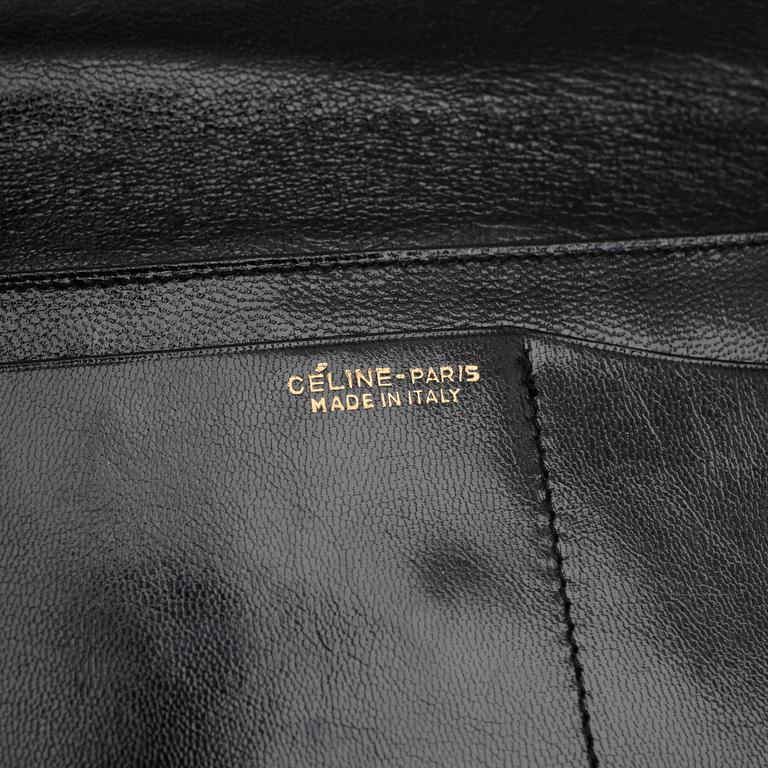 CÉLINE, a black leather evening bag.