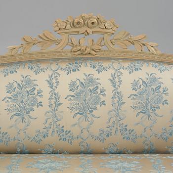 A grey-painted Gustavian 'canapé en corbeille'. sofa, later part of the 18th century.