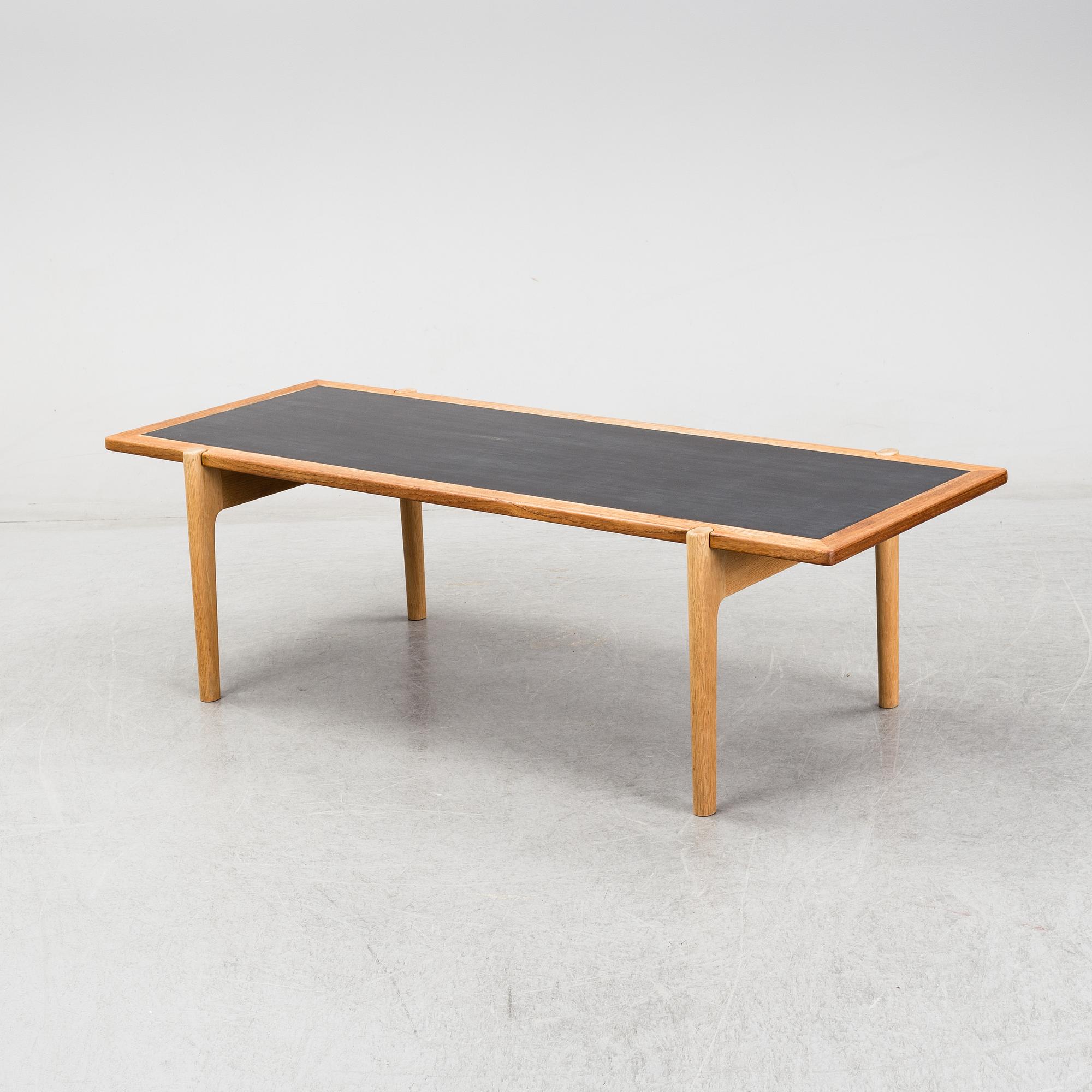 A model JH 575 coffee table by Hans J Wegner for Johannes Hansen.