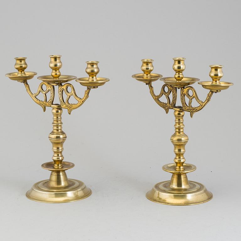 A apir of brass Baroque style candelabra, circa 1900.