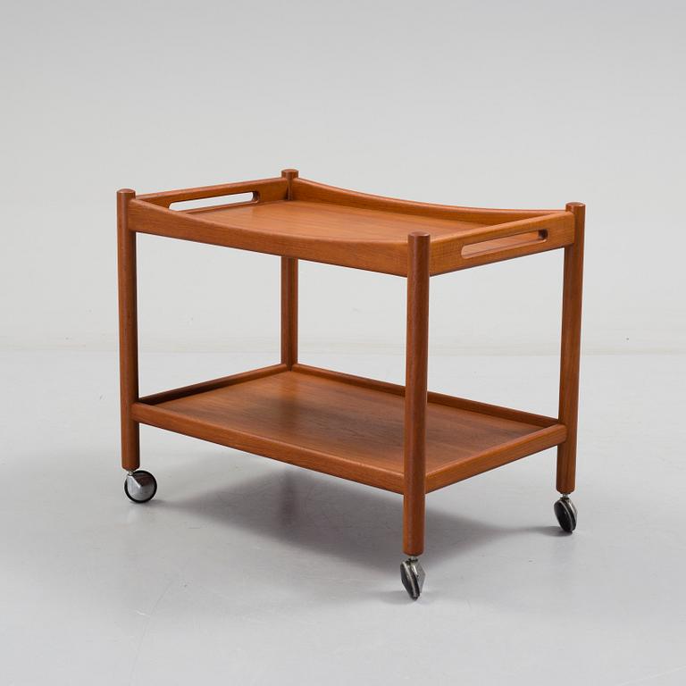 A Hans J Wegner serving trolley veneered with teak.