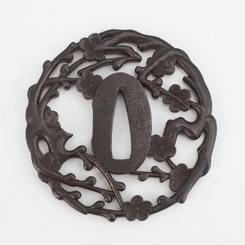 A signed iron tsuba, 18th Century.