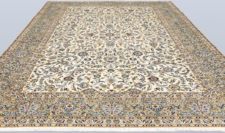 A Keshan carpet, signed, approx. 390 x 282 cm.