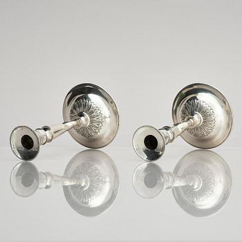 Two pair of early 19th century silver candlesticks, marks of Anders Lundqvist, Stockholm, Sweden 1819 and 1821.
