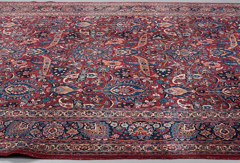 A CARPET, a semi-antique Mashad, ca 400-404 x 314 cm.