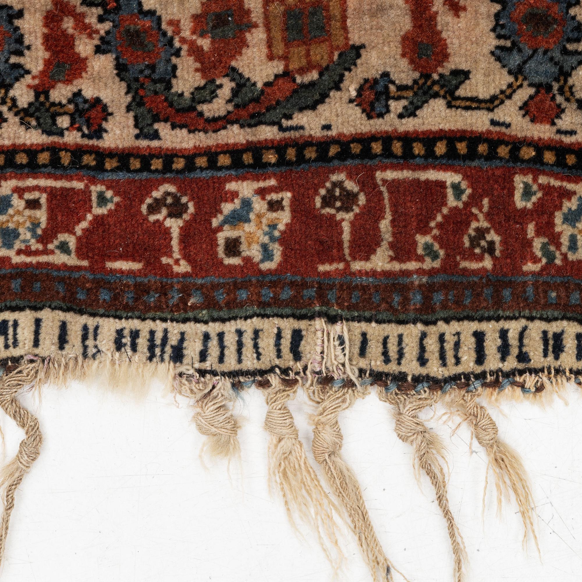 An antique Qashqai rug, southeastern Iran, c 204 x 102 cm.