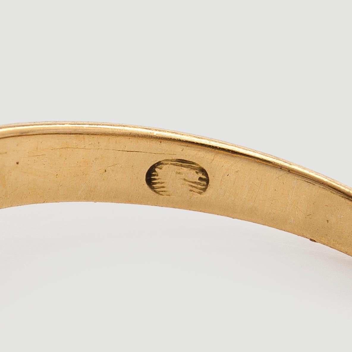 An 18K gold ring with old-cut diamonds.