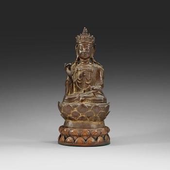 1299. A bronze figure of Guanyin, Ming dynasty with archaistic characters to back.