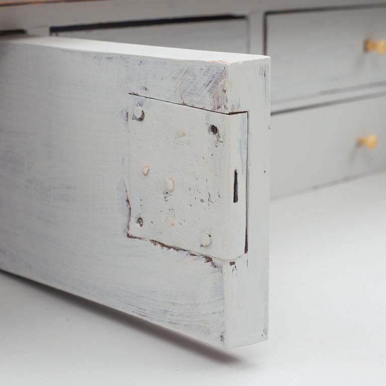 A Gustavian style chest of drawers, early 20th century.