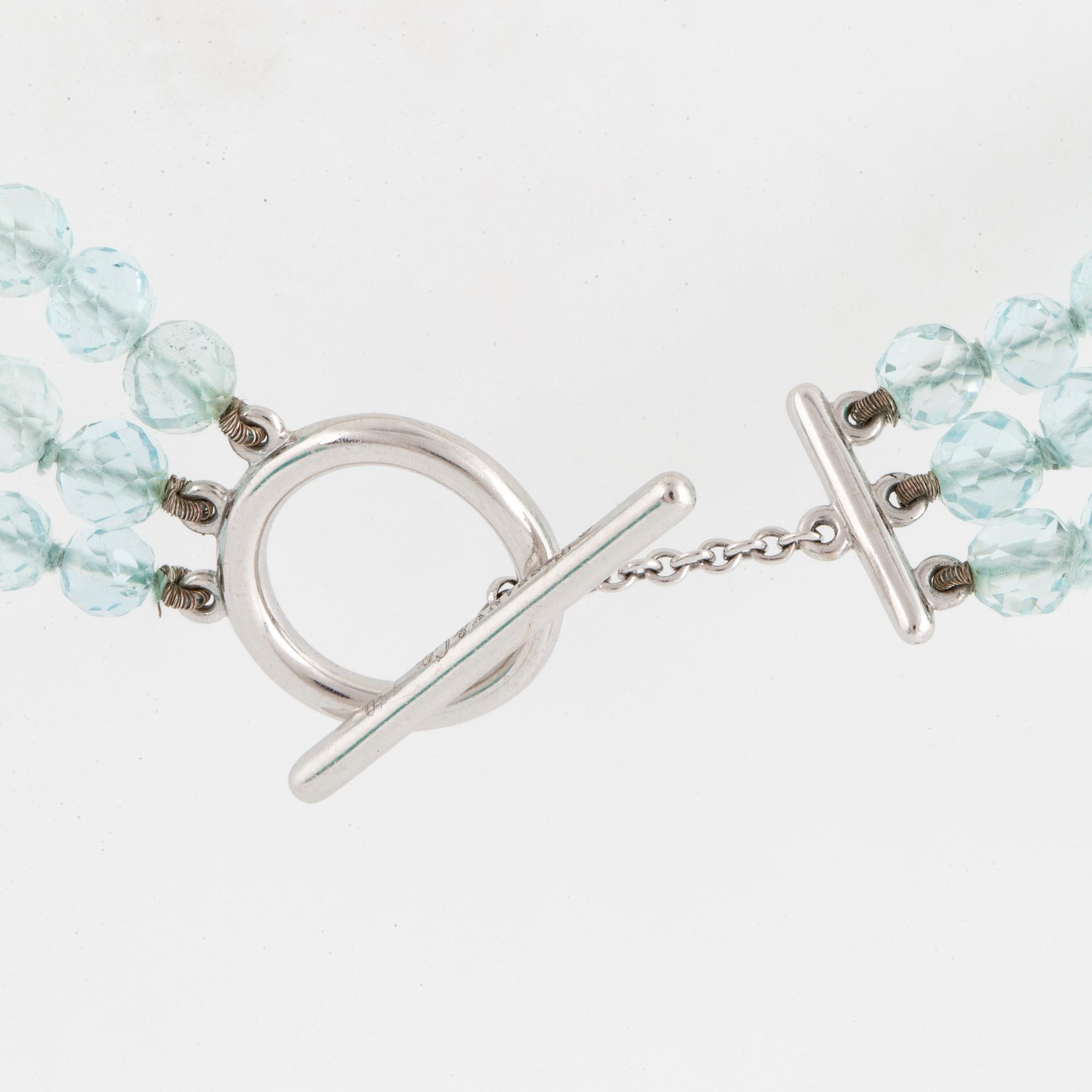 A Tiffany & Co three strand faceted aquamarine bead necklace with an 18K white gold clasp.