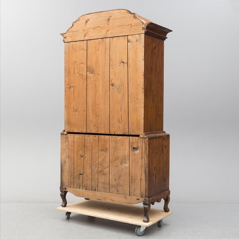 a 1700's Rococo pine cabinet.