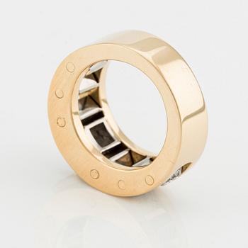 An 18K gold Gaudy ring with a princess-cut diamond.