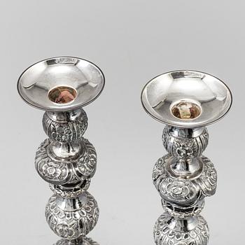 A pair of silver Sabbath candlesticks, Maker M. Sztern, Warsaw, Poland. Assayer Josef Sosnkowski, 1864. Weight 833 g.