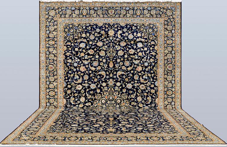 A Keshan carpet, signed, approx. 600 x 400 cm.