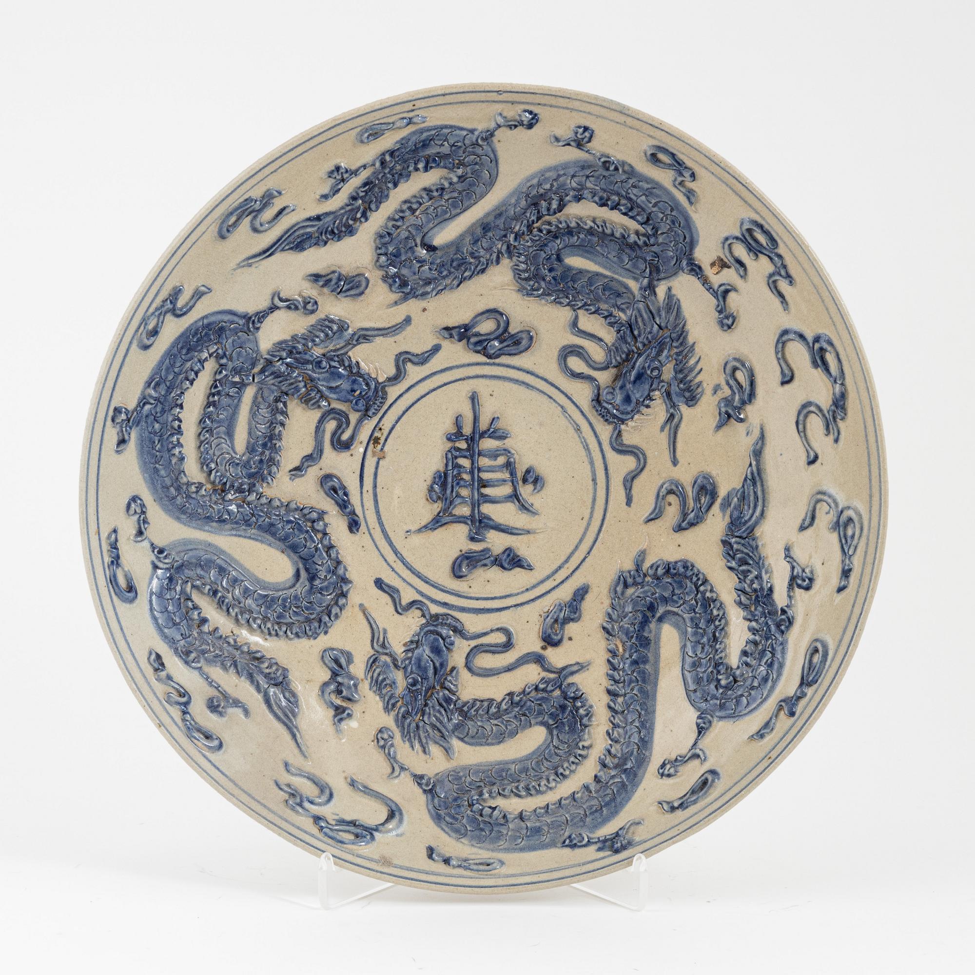 A ceramic dragon dish, Sout East Asia, 20th century.