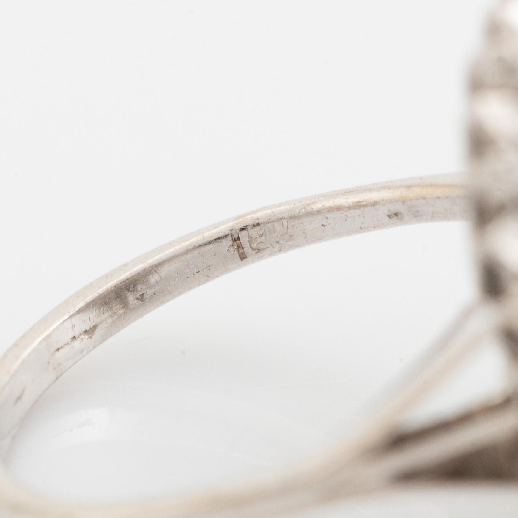 Emerald-cut emerald and eight cut diamond ring.